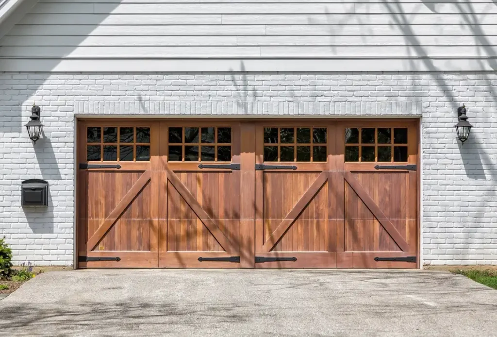 Wood carriage-style garage door with window panels